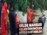 Selde mahsur kalan öğrenciler nehre gerilen iple kurtarıldı