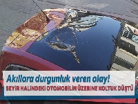 Seyir halindeki otomobilin üzerine 5'inci kattan atılan koltuk düştü