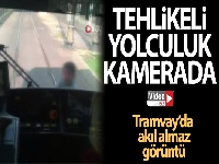Tramvay arkasında tehlikeli yolculuk kamerada