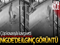 Çöp kovasıyla kavga eden adam kameraya yansıdı