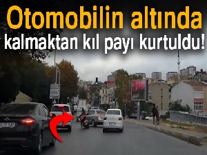 Otomobilin altında kalmaktan kıl payı kurtuldu!