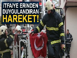 Yangına müdahele eden itfaiye eri duvardaki Türk Bayrağı için seferber oldu