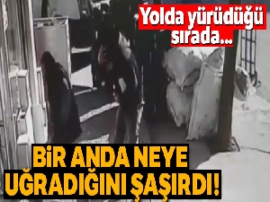 Binanın önünde beklerken kafasına cam parçası düştü