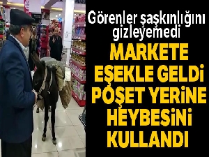 Markete eşekle geldi, poşet yerine heybesini kullandı