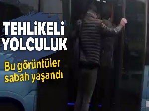 Minibüsün kapısında tehlikeli yolculuk