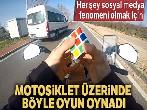 Motosiklet üzerinde rubik küp çözdü, oyun oynadı