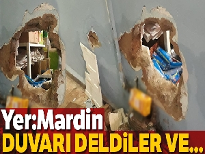 Duvarı delip marketi soydular !