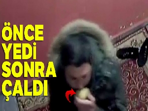 Elma yiyerek ayakkabı çalan hırsız kamerada