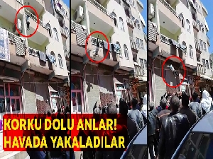 Balkondan düşen çocuğu vatandaşlar havada yakaladı