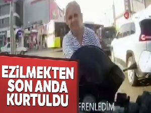 Dikkatsiz kadının ezilmekten son anda kurtuldu