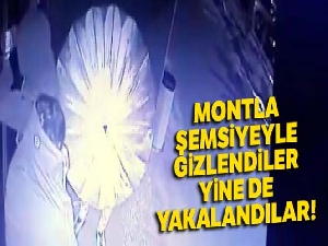Montla şemsiyeyle gizlendiler, yine de yakalandılar