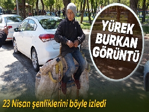 Batman'da yürek burkan görüntü! 23 Nisan şenliklerini kağıt topladığı aracının üzerinde izledi...