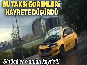 TEM Otoyolu'nda kaputu açık halde seyreden taksi hayrete düşürdü