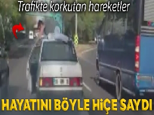 Başkent'te otomobilin üzerine çıkan yolcu hayatını hiçe saydı
