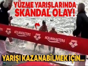 Yarışı kazanabilmek için çocuk sporcuyu iterek denize düşürdü