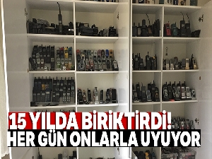 15 yılda biriktirdiği cep telefonları ile uyuyor