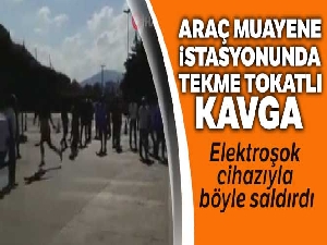 Araç muayene istasyonunda elektroşok cihazıyla görevlilere saldıran şahıs kamerada