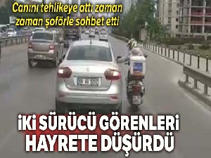 Arızalanan motosikletiyle otomobilin camına tutunup seyahat eden motosikletli kamerada