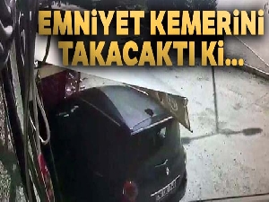 Emniyet kemerini takarken kaza yapan sürücü kamerada