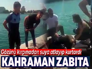 Kahraman zabıta sıcaktan bayılıp denize düşen kadını kurtardı