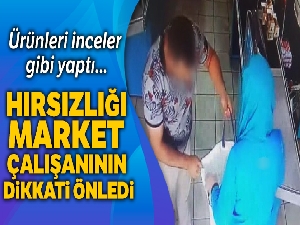 Markette ürünleri çantasına saklayarak çalmaya çalışan hırsız kamerada