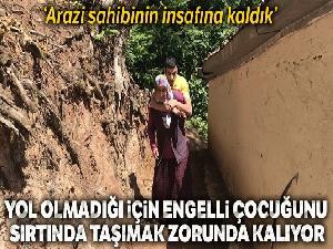 Engelli genç yolu olmayan evine annesinin sırtında gidiyor