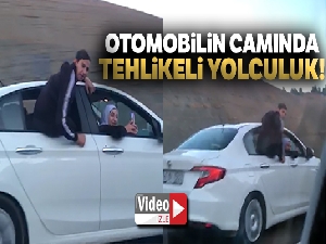 Otomobilin camında tehlikeli yolculuk