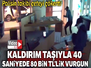 Kaldırım taşı ile 40 saniyede 80 bin TL'lik vurgun yapan hırsızlar kamerada