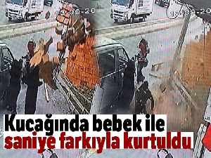 Kucağında bebek ile saniye farkıyla kurtuldu
