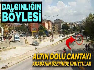 Aracın üstünde unutulan altın dolu çanta yola düştü