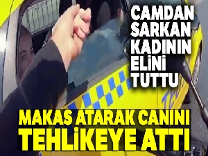 Önce camdan sarkan kadının elini tuttu, sonra makas atarak canını tehlikeye attı
