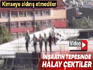 İşçiler inşaatın tepesinde halay çekti