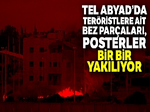 Tel Abyad'da terör örgütüne ait bez parçaları ve posterler kaldırılıyor