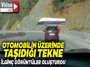 Otomobil üzerinde taşınan tekne ilginç görüntülere sahne oldu