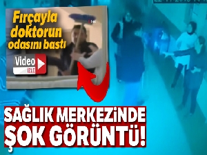 Eşine bağırdığını iddia ettiği doktorun odasını fırçayla basan şahıs kamerada