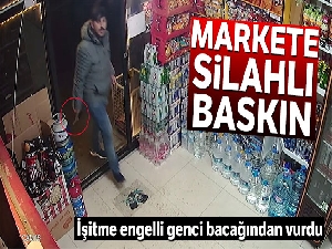 Siparişi gelmeyen şahsın silahla marketi bastığı anlar kamerada