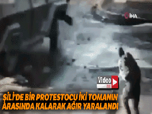Şili'de bir protestocu, iki tomanın arasında ezilerek ağır yaralandı