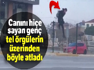 Canını hiçe sayan genç tel örgülerin üzerinden böyle atladı