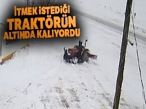 İtmek istediği traktörün altında kalıyordu