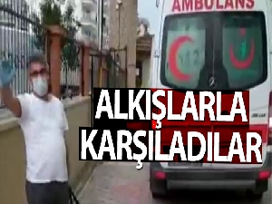Taburcu olan Korona virüs hastası, komşularınca alkışlarla karşılandı