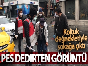 İstanbul'da koltuk değnekleriyle dışarıya çıkan yaşlı adam 'pes' dedirtti