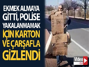 Polise yakalanmamak için karton ve çarşafla gizlendi