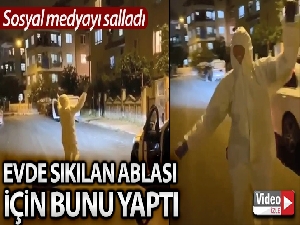 Evde sıkılan ablası için koruyucu tulumla açık hava konseri verdi
