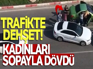 Trafikte tartıştığı kadınları sopayla dövdü