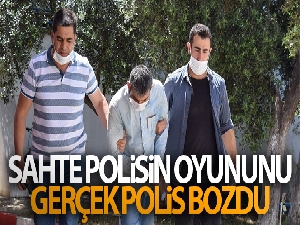 Sahte polis, gerçek polisi görünce ne yapacağını şaşırdı