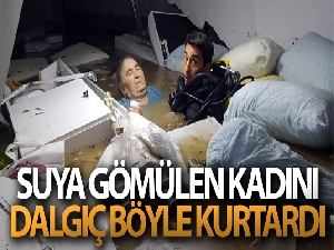 Su basan tıp merkezinin bodrumundaki kadını dalgıç polis kurtardı