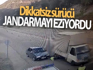 Dikkatsiz sürücü jandarmayı eziyordu