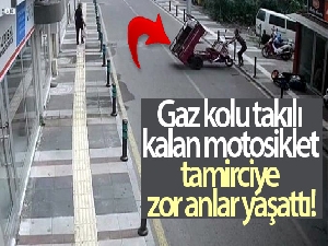 Gaz kolu takılı kalan motosiklet tamirciye zor anlar yaşattı