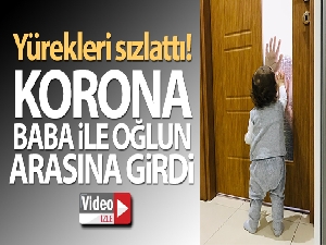 Koronalı baba çocuğunu camın arkasından seviyor