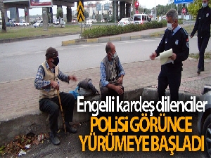 Engelli kardeş dilenciler, polisi görünce yürümeye başladı